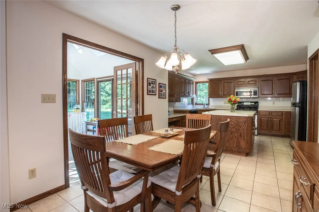 Open dining kitchen and sunroom ideal for hosting family and friends.