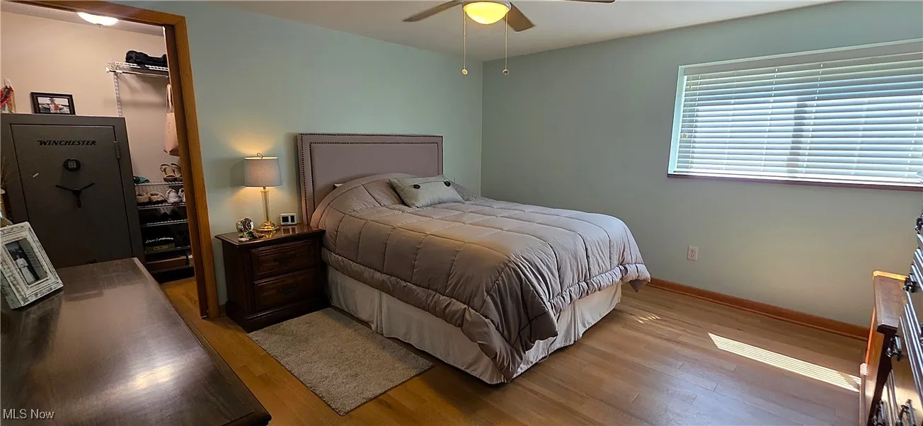 1st floor Master Bedroom with two walk in closets, and ceiling fan