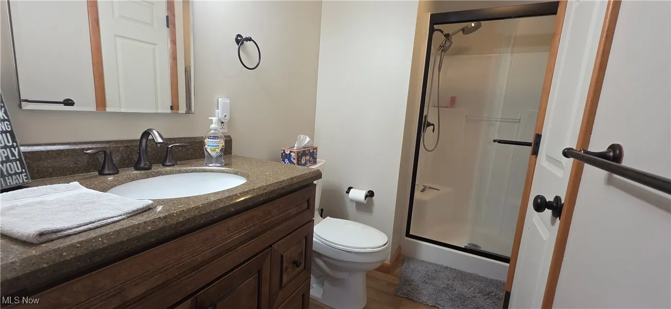 1st floor full Bathroom featuring a stall shower.