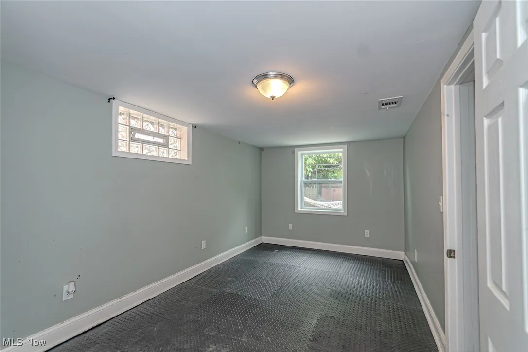 Empty room featuring healthy amount of natural light