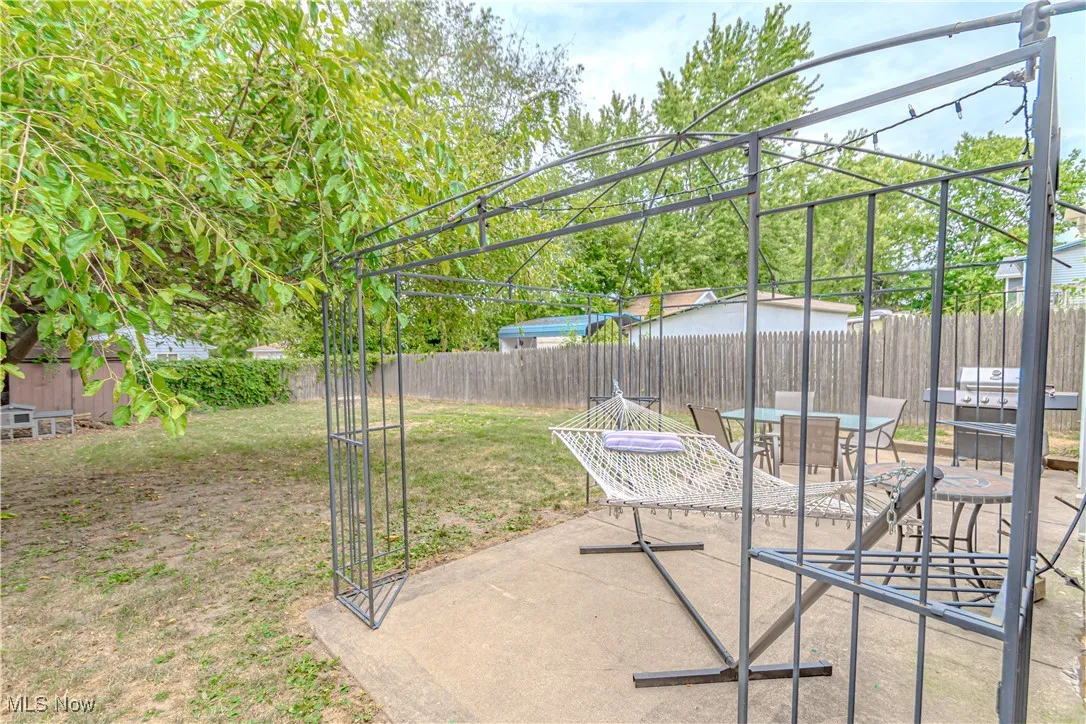 Fenced backyard with a patio area