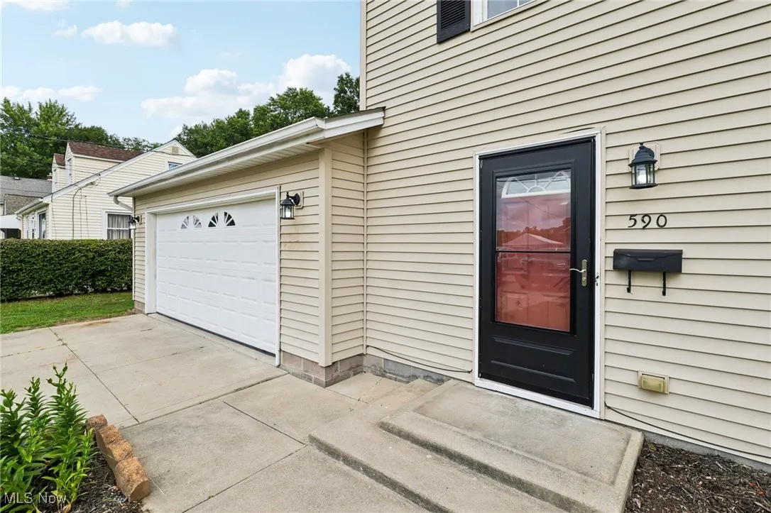 Garage with concrete driveway