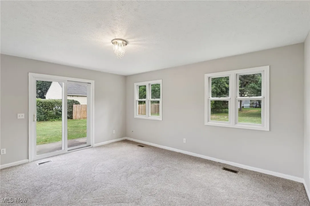 Spare room with carpet and a textured ceiling