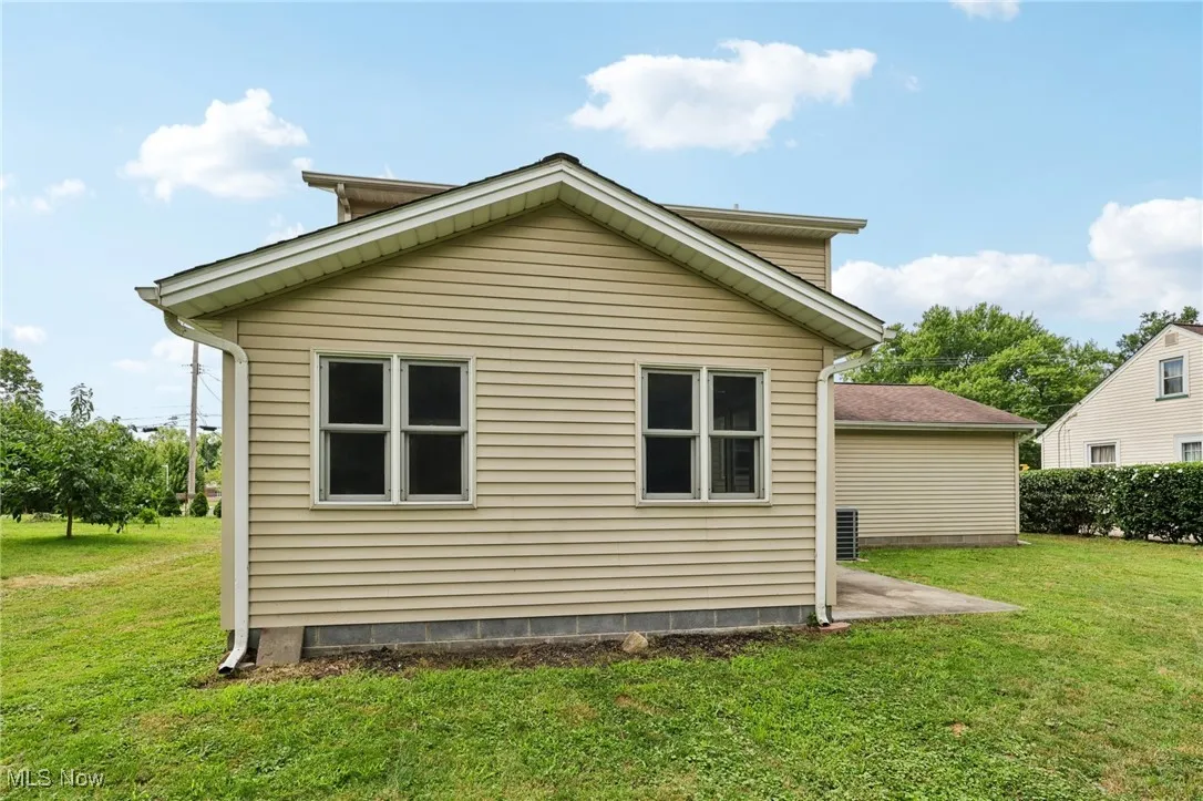 View of home's exterior with a lawn