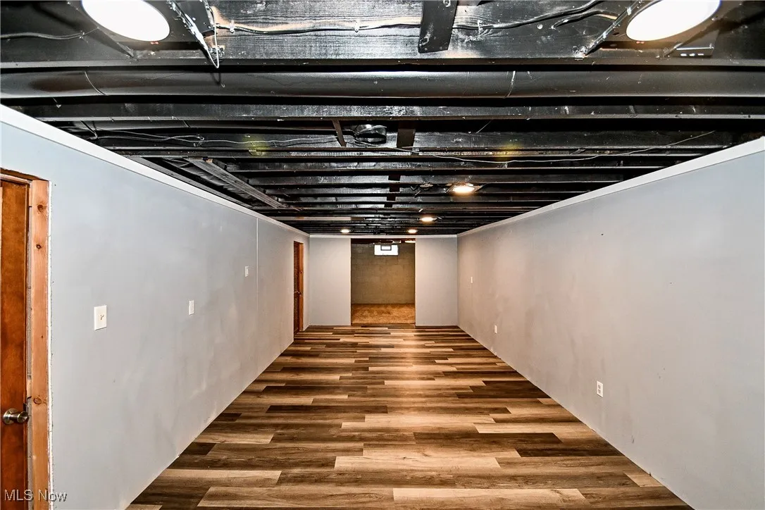 Finished basement featuring wood finished floors
