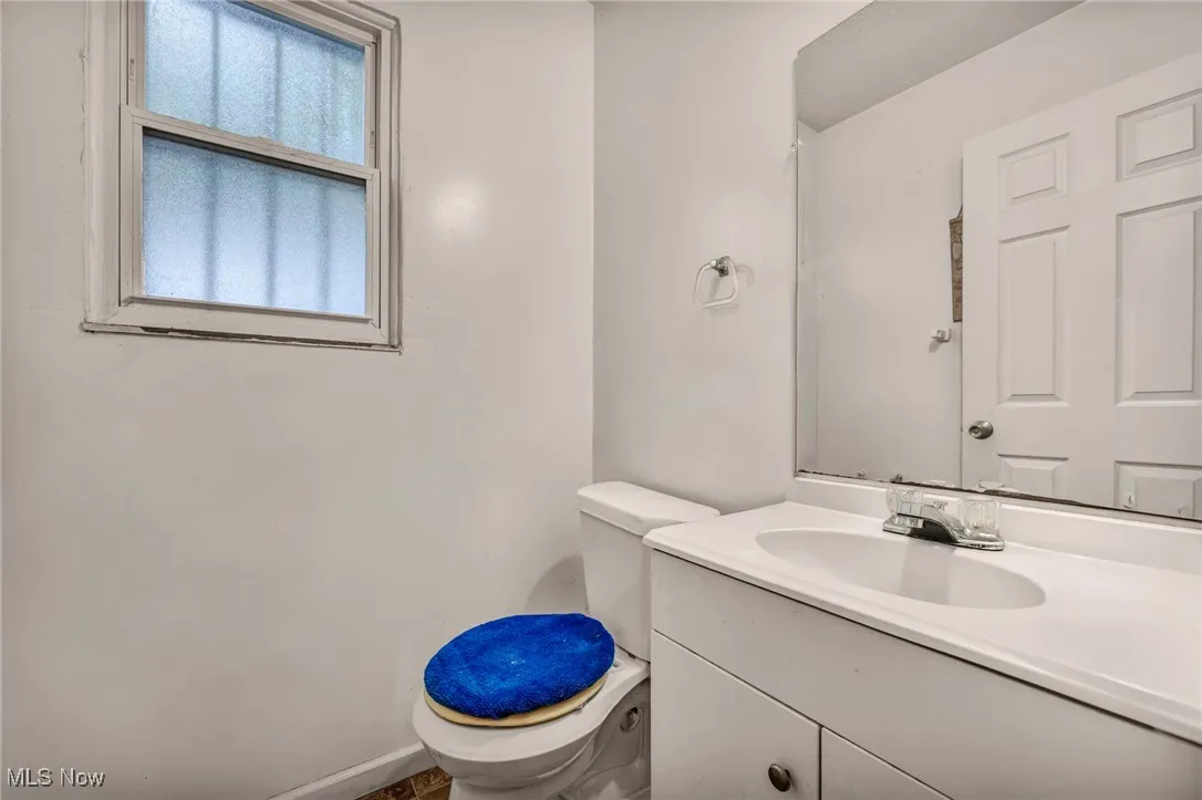 Half bath with toilet and vanity