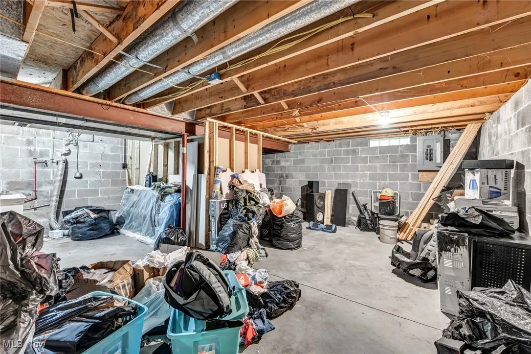 Unfinished below grade area with electric panel