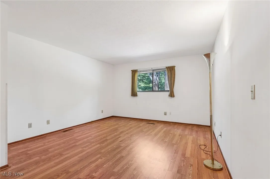 Spare room with light wood finished floors and baseboards