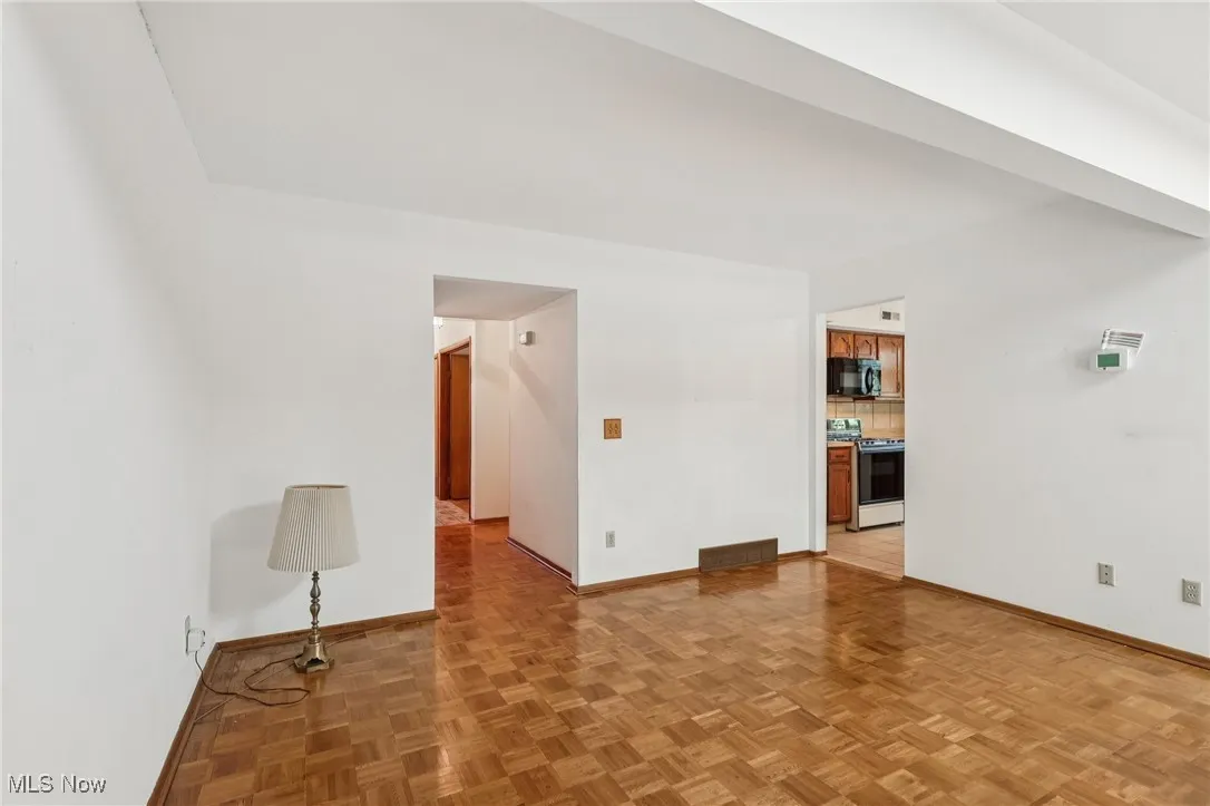 Unfurnished room featuring baseboards