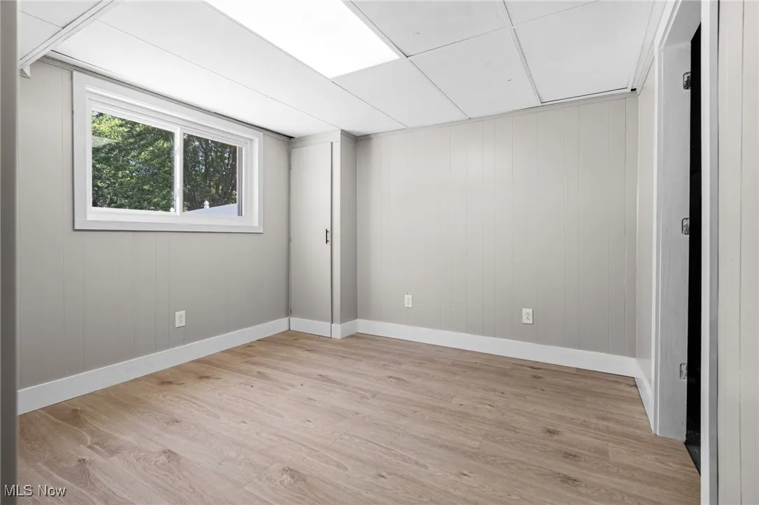 In home office on lower level with new paint, new flooring and new windows