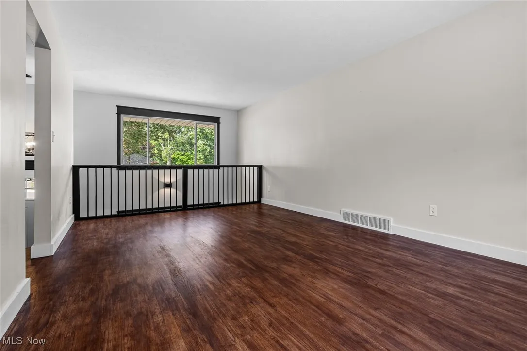 Living room with wood-style floors and 2 pictures windows