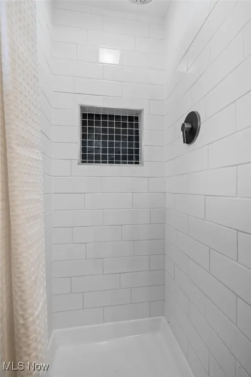 Bathroom with a tile shower