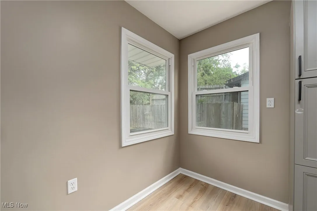 Doorway featuring wood finished floors and plenty of natural light