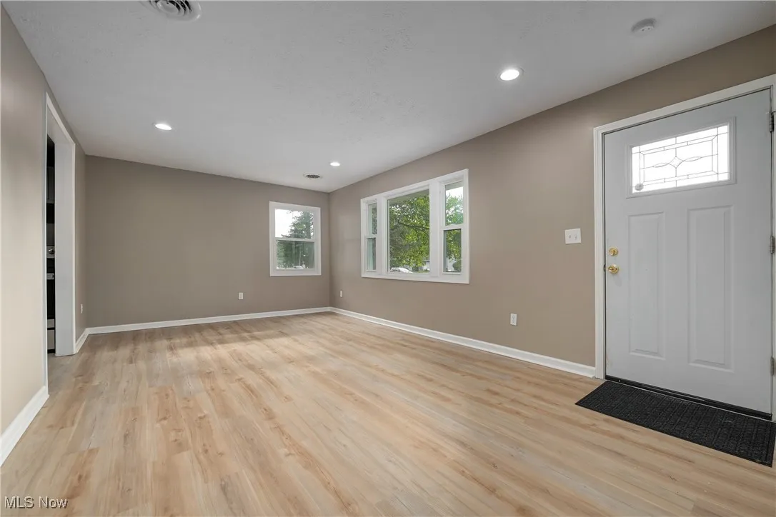 Foyer featuring light wood-type flooring and recessed lighting
