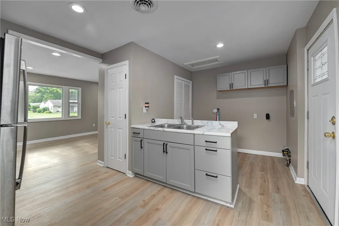 Kitchen featuring recessed lighting and light wood-style flooring