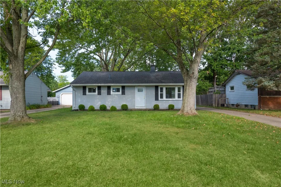 Ranch-style home with a detached garage