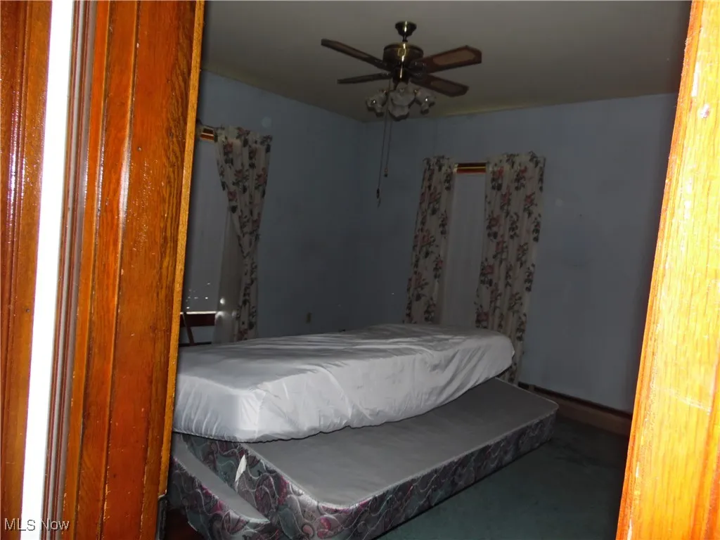 Bedroom featuring a ceiling fan