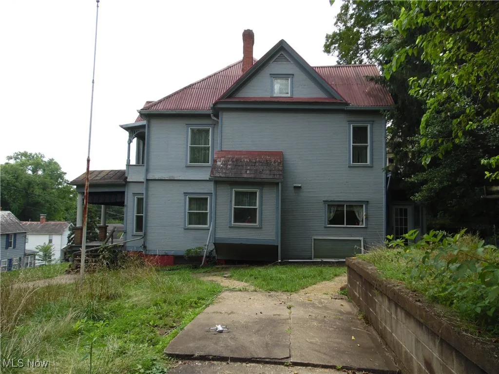 Rear view of house with a chimney
