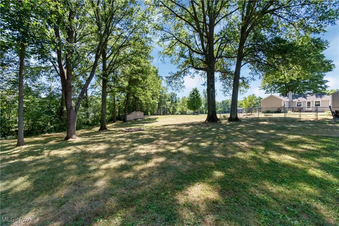 View of yard with a storage unit