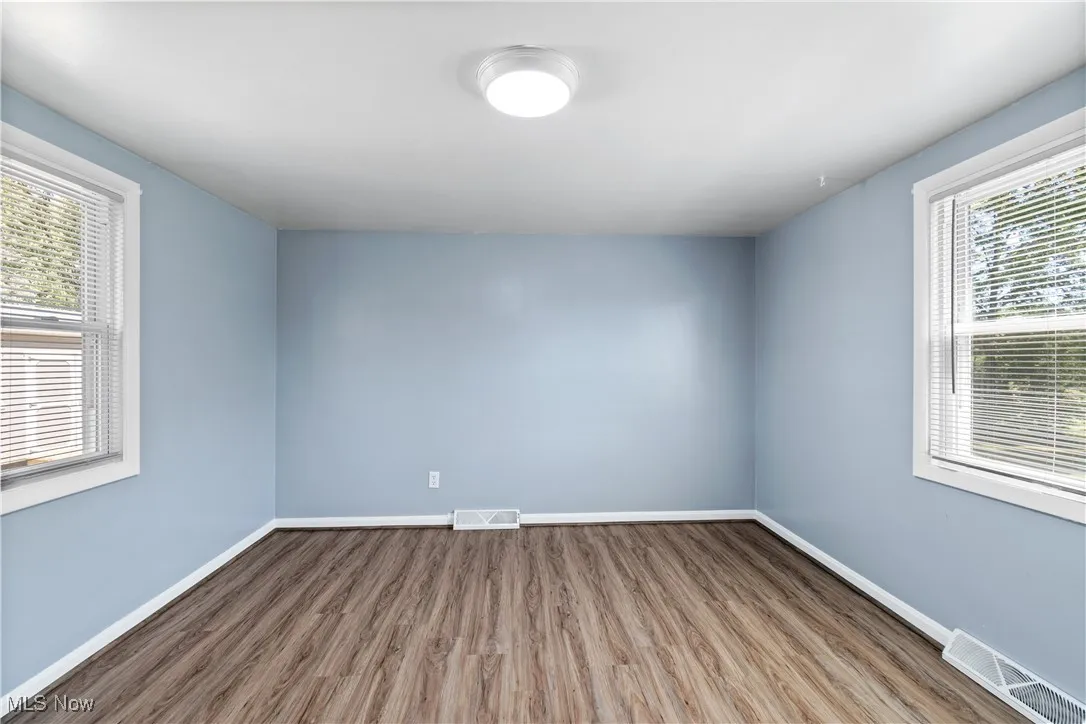 Unfurnished room featuring wood finished floors