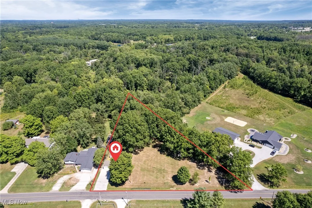 Aerial overview of property's location featuring property parcel outlined