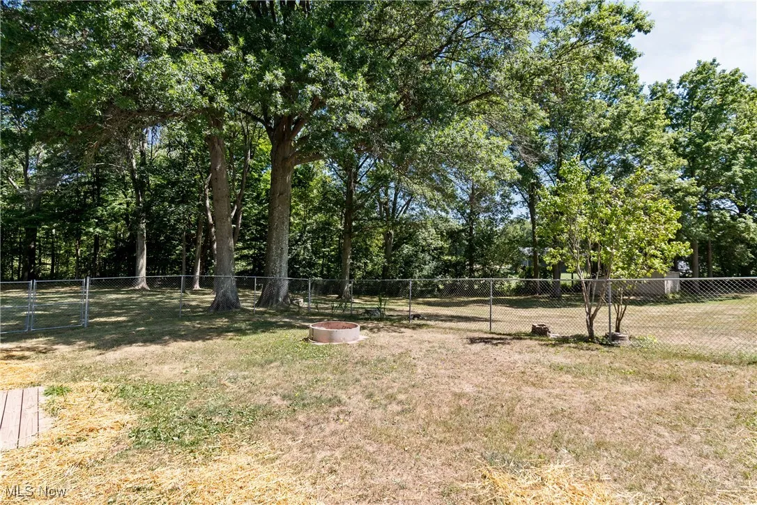 View of yard featuring view of wooded area