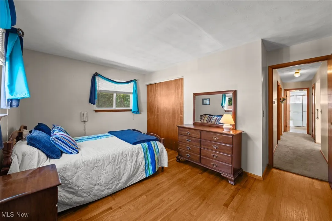 Bedroom featuring a closet and wood finished floors