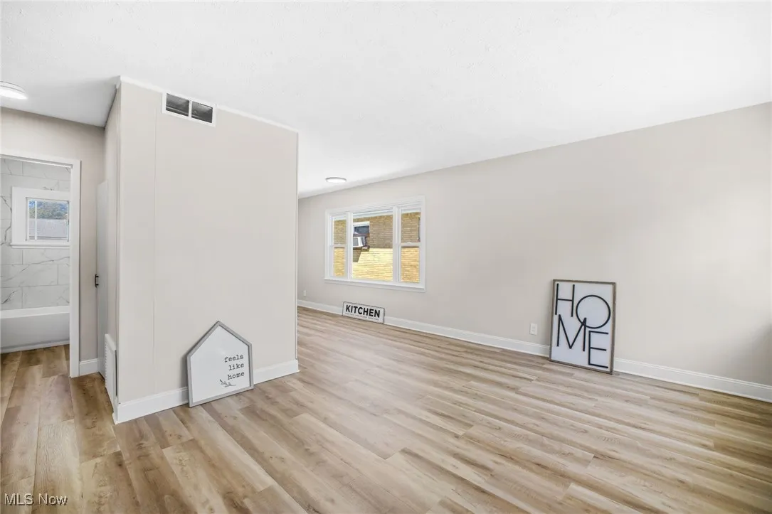 Unfurnished living room with light wood-type flooring