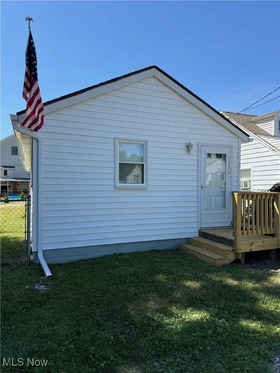 Back of property with a wooden deck