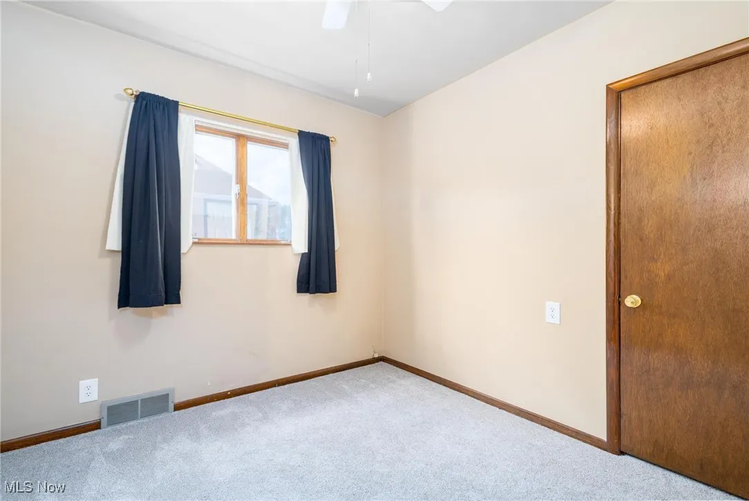 Bedroom 2 with new carpet & ceiling fan