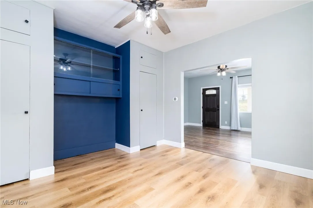 Dining Room with ceiling fan and built in shelving