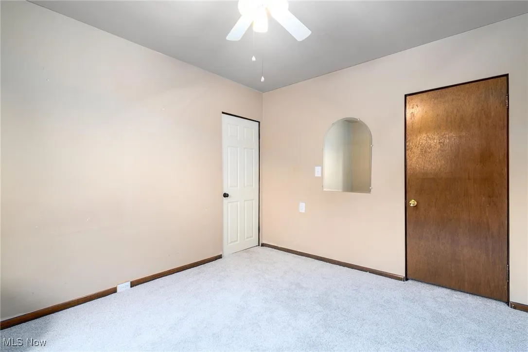 Bedroom 1 with new carpet & ceiling fan