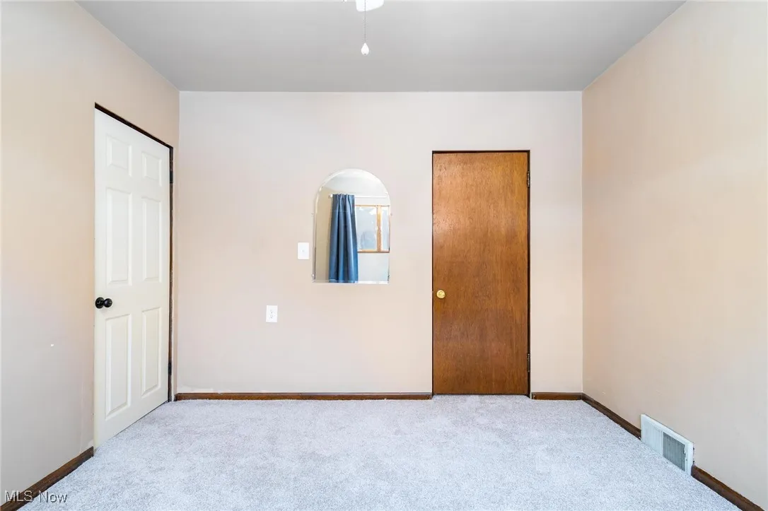 Bedroom 1 with new carpet & ceiling fan