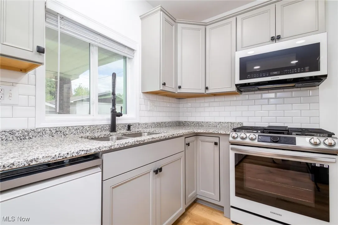 Kitchen with stainless steel appliances and granite countertops