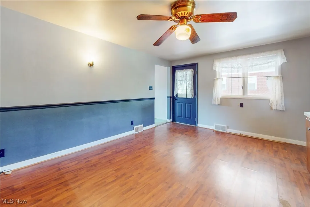 Spare room with light wood-style flooring and a ceiling fan