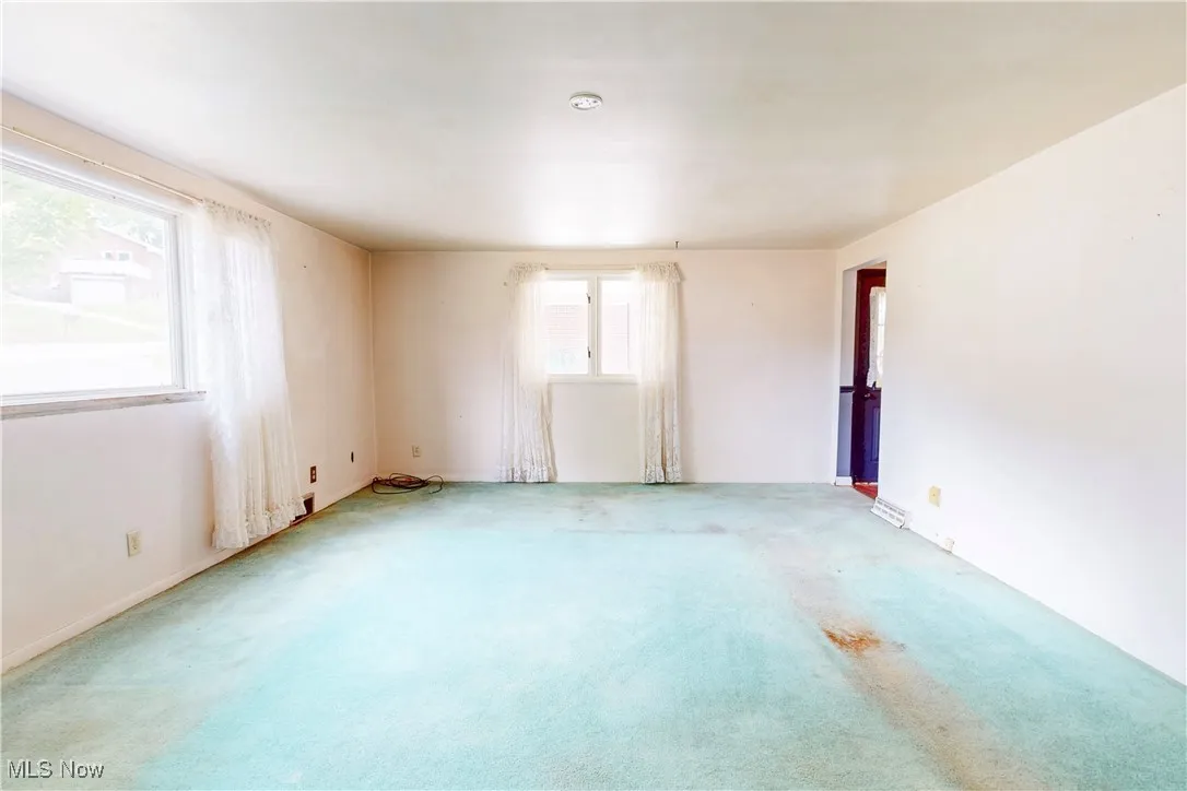 Empty room featuring carpet