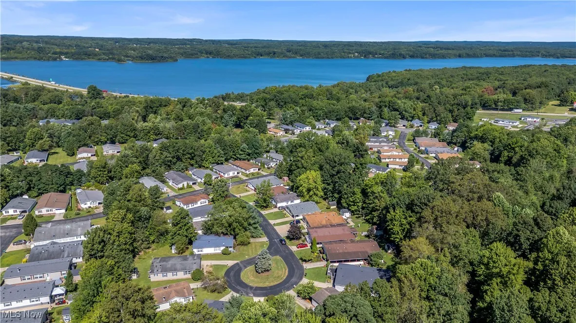 View of property location with nearby suburban area and a nearby body of water