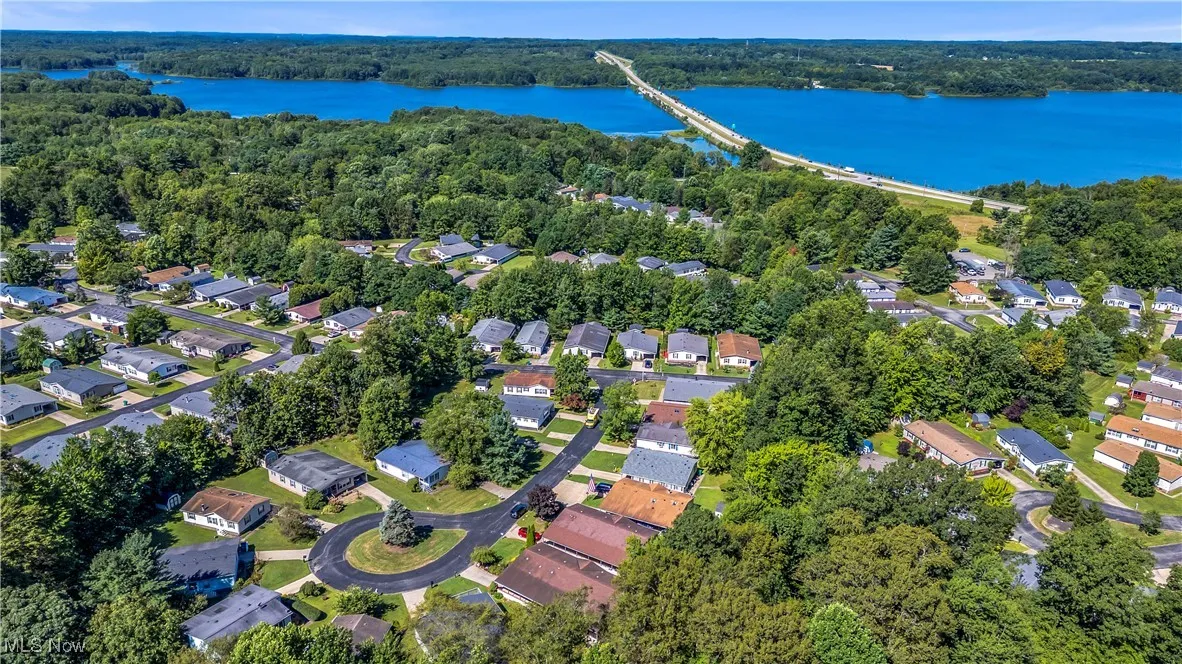 Aerial view of property's location with nearby suburban area, a notable bridge, and a nearby body of water