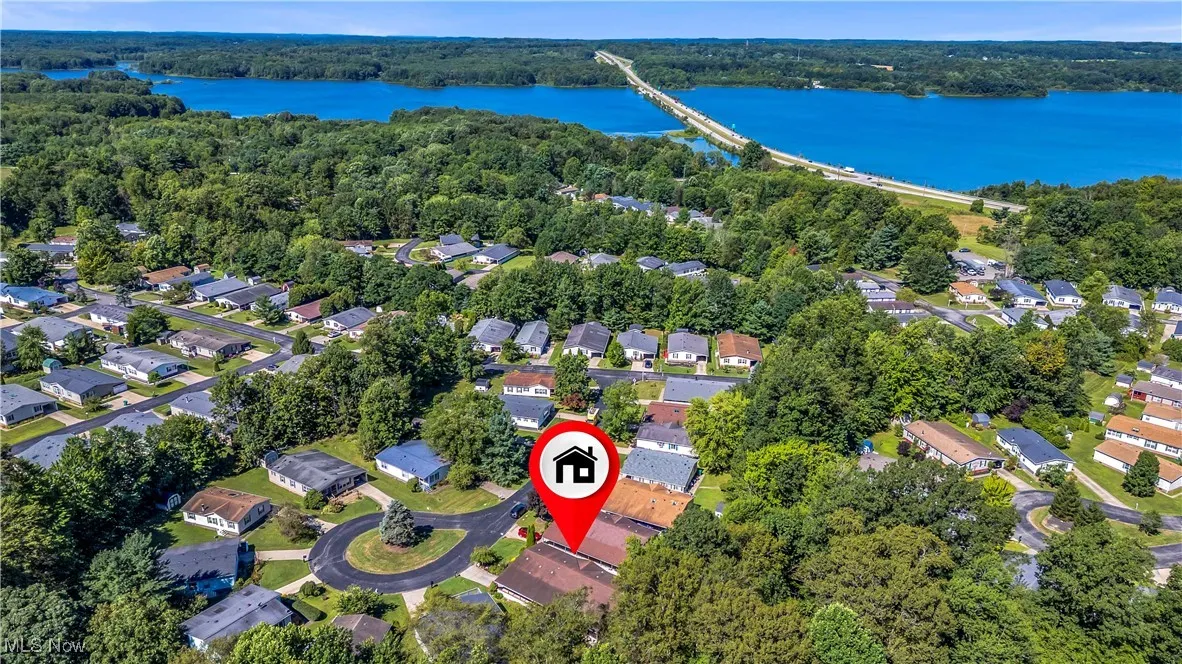 View of property location with nearby suburban area, a notable bridge, and a large body of water