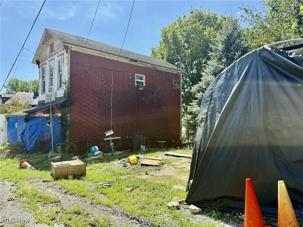 View of side of home featuring a carport