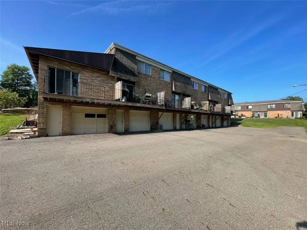 View of property featuring a garage
