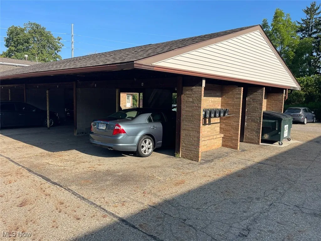 Garage featuring covered parking