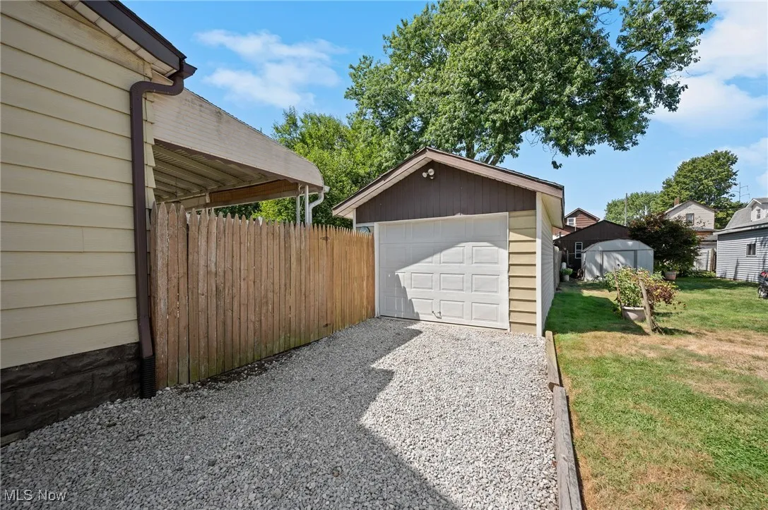 Detached garage featuring driveway