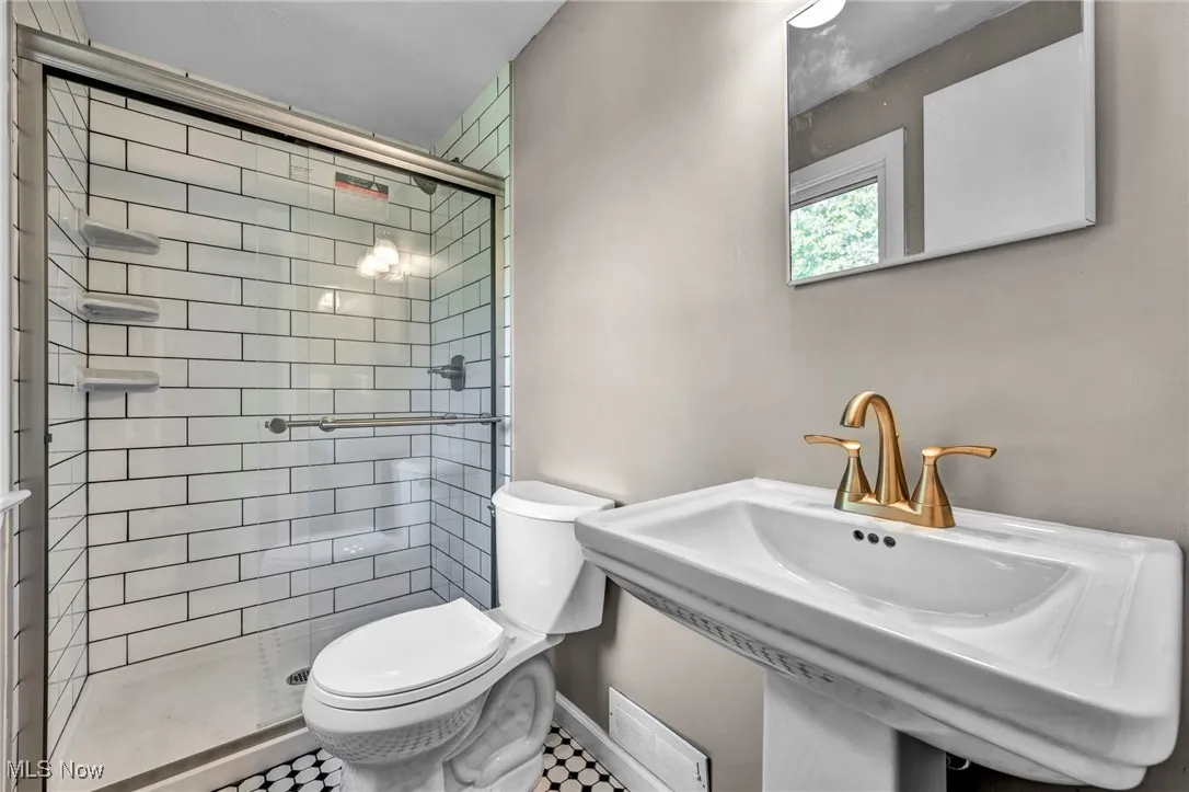 Bathroom featuring a shower stall