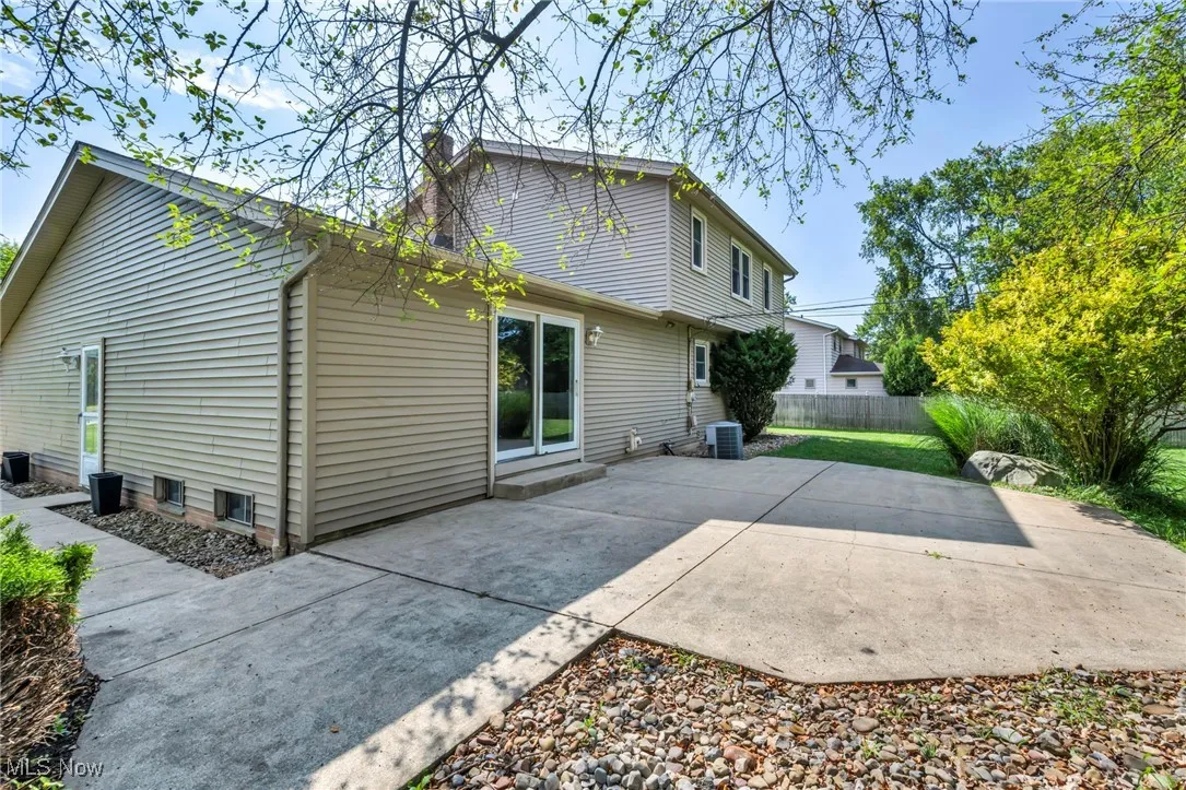 Rear view of house featuring a patio