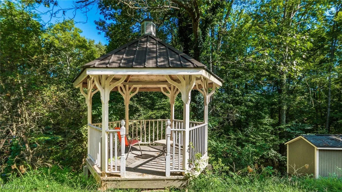 View of yard with a gazebo and a storage shed