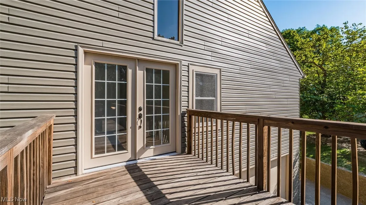 Wooden deck featuring french doors