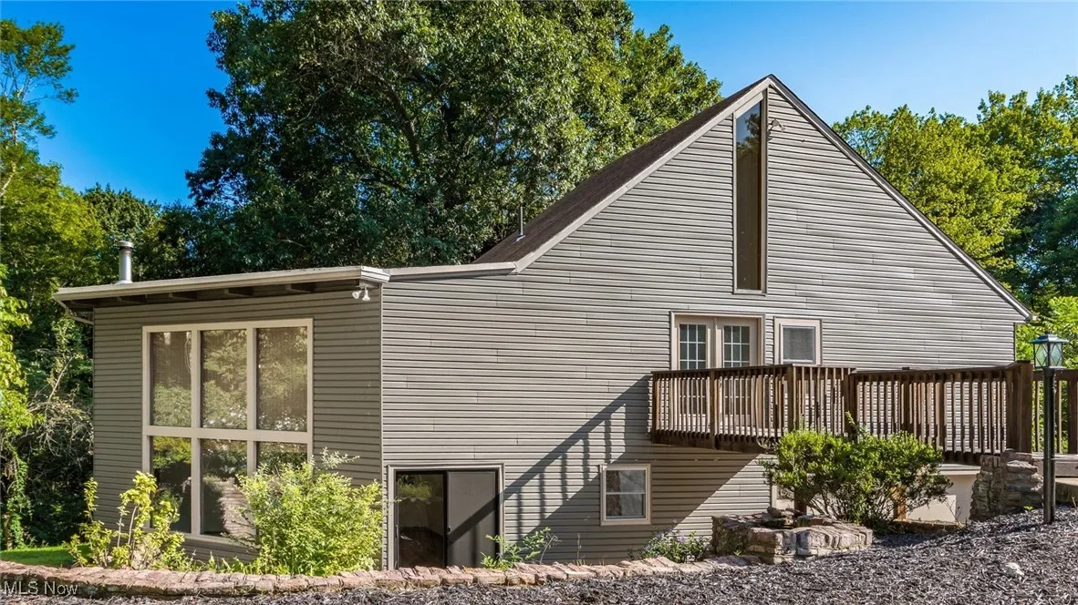 Back of property with a deck