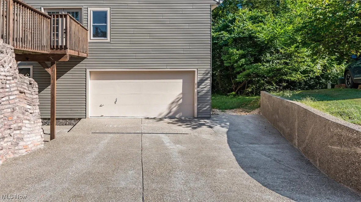 Garage with concrete driveway