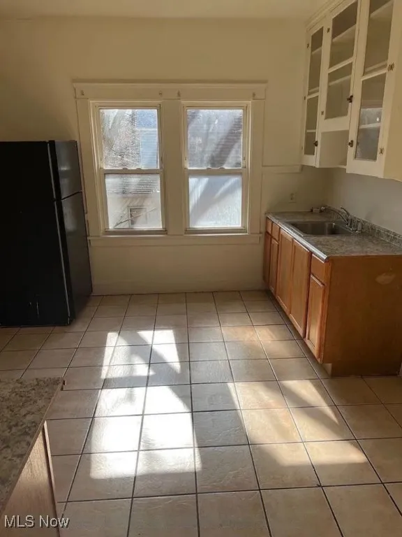 Unfurnished dining area featuring light tile patterned floors